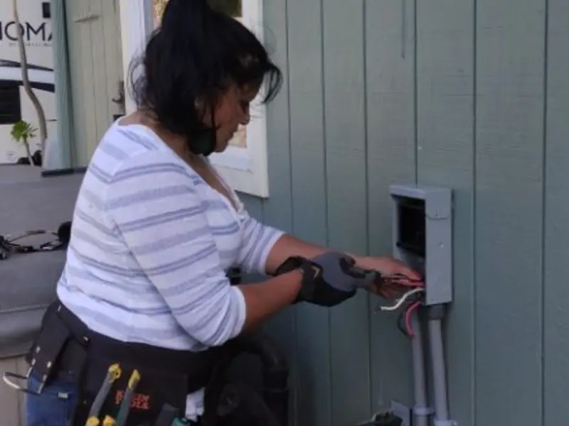 Licensed electrician wiring an exterior subpanel in Mountain View